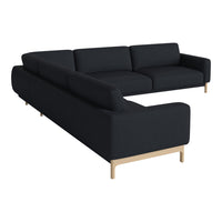 L-shaped modern sofa with a sleek black upholstery and light wooden legs, perfect for contemporary decor.