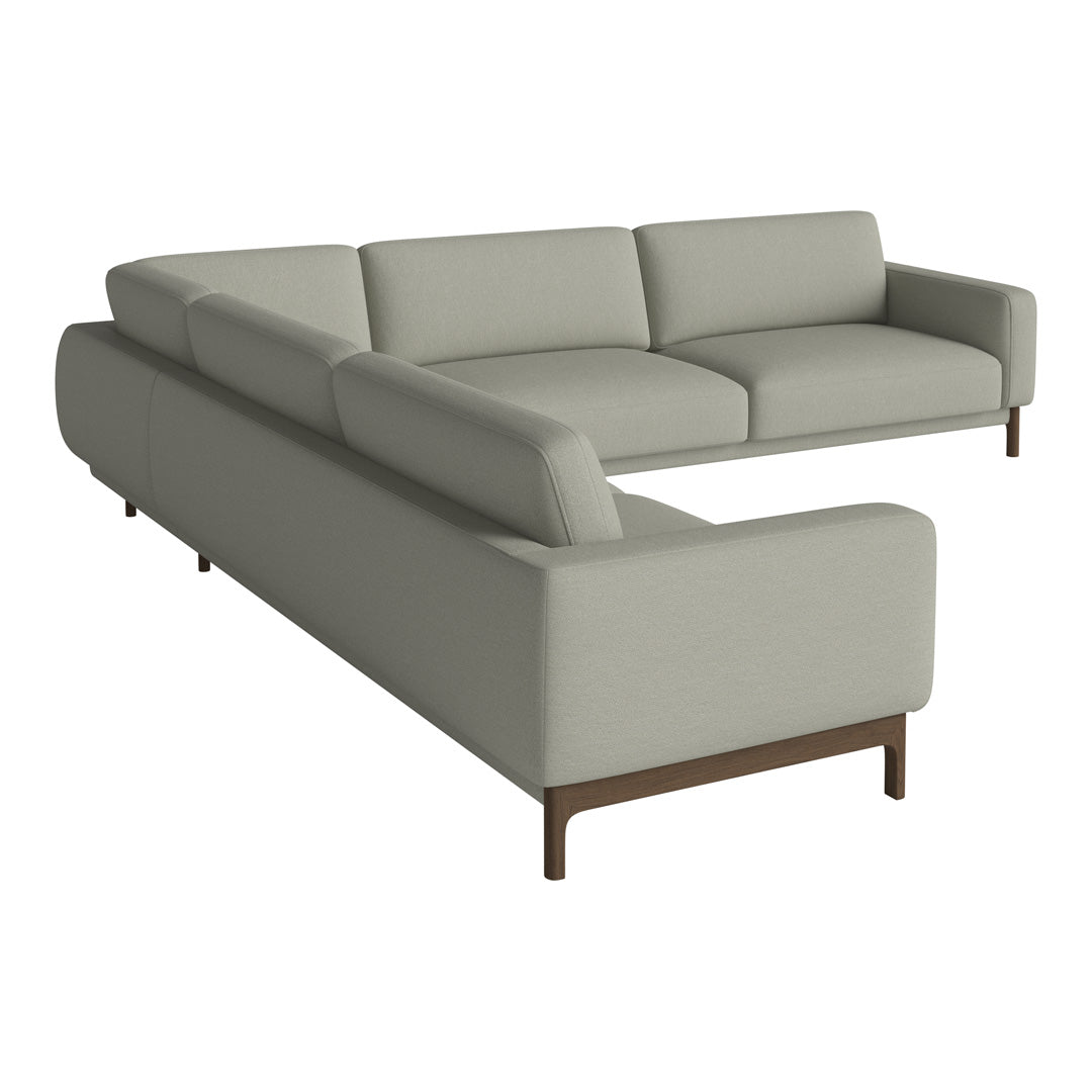 Modern light gray sectional sofa with clean lines and subtle texture, accented by dark wooden legs.