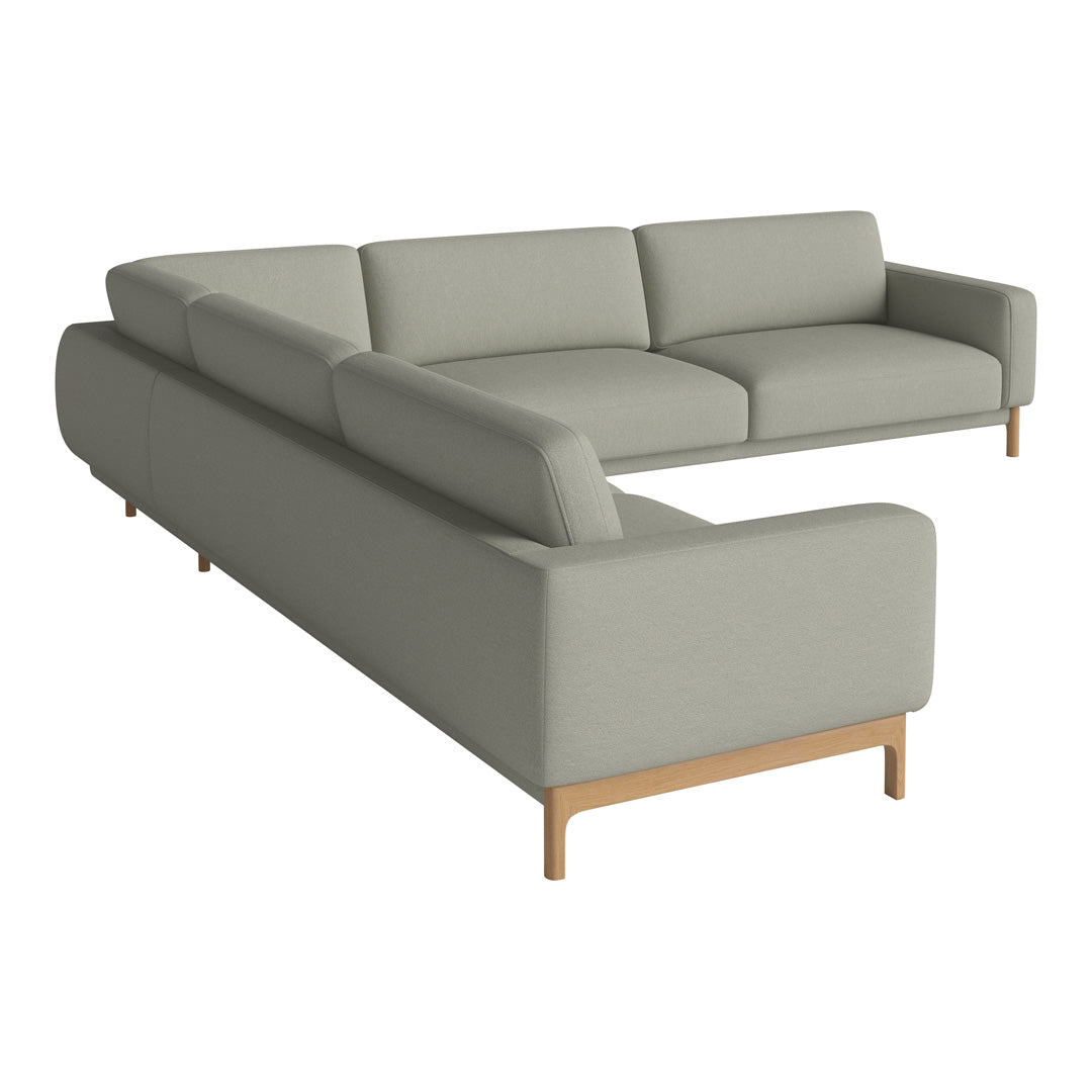 Light gray sectional sofa with clean lines and minimalistic design, featuring a wooden base. Perfect for modern decor.