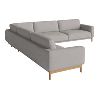 Light grey sectional sofa with a minimalist design and natural wood legs, featuring smooth, clean lines.