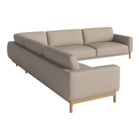 Light beige sectional sofa with smooth, minimalist design and natural wood legs, perfect for modern decor.