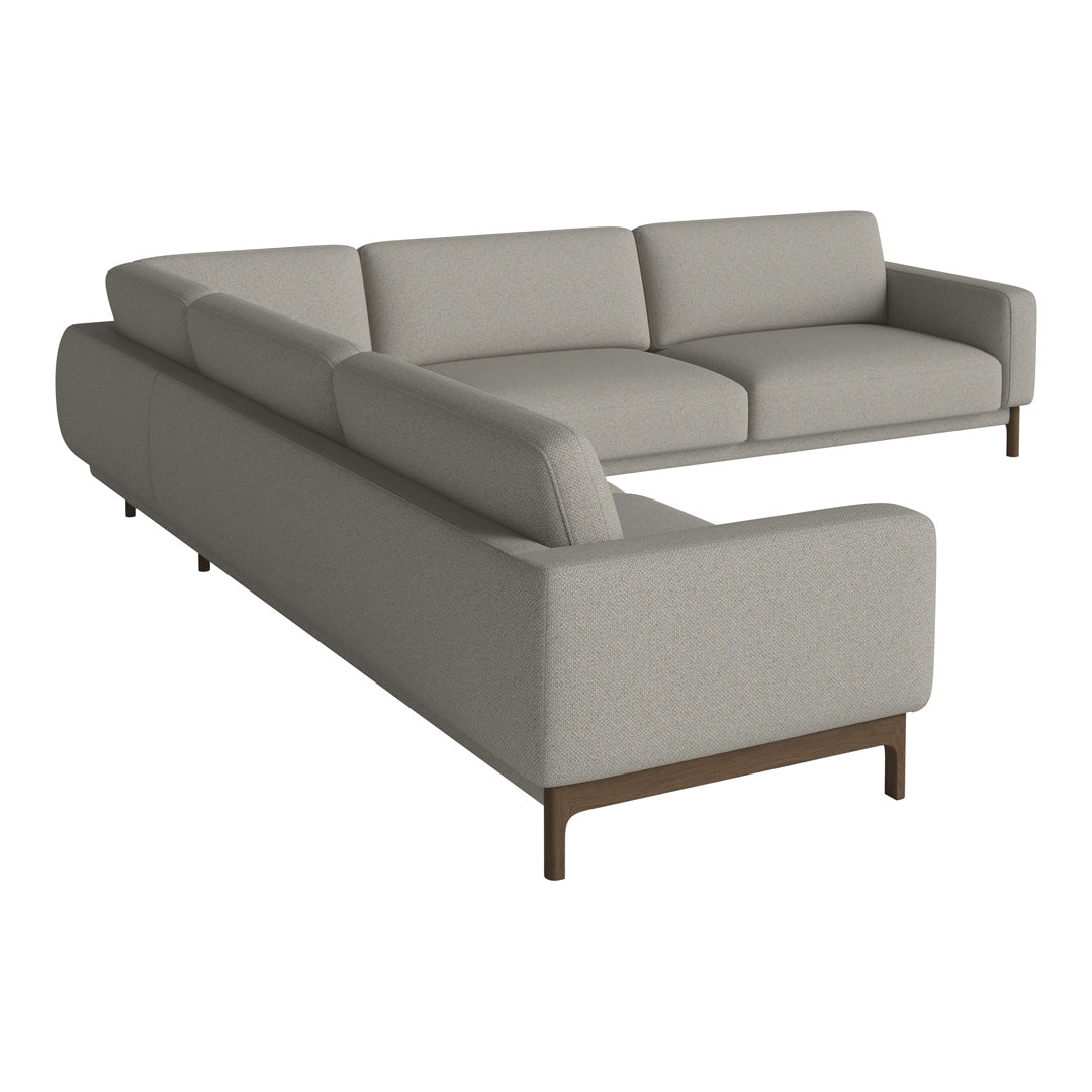 Light gray sectional sofa with smooth upholstery and minimalist design, featuring wooden legs for a modern touch.