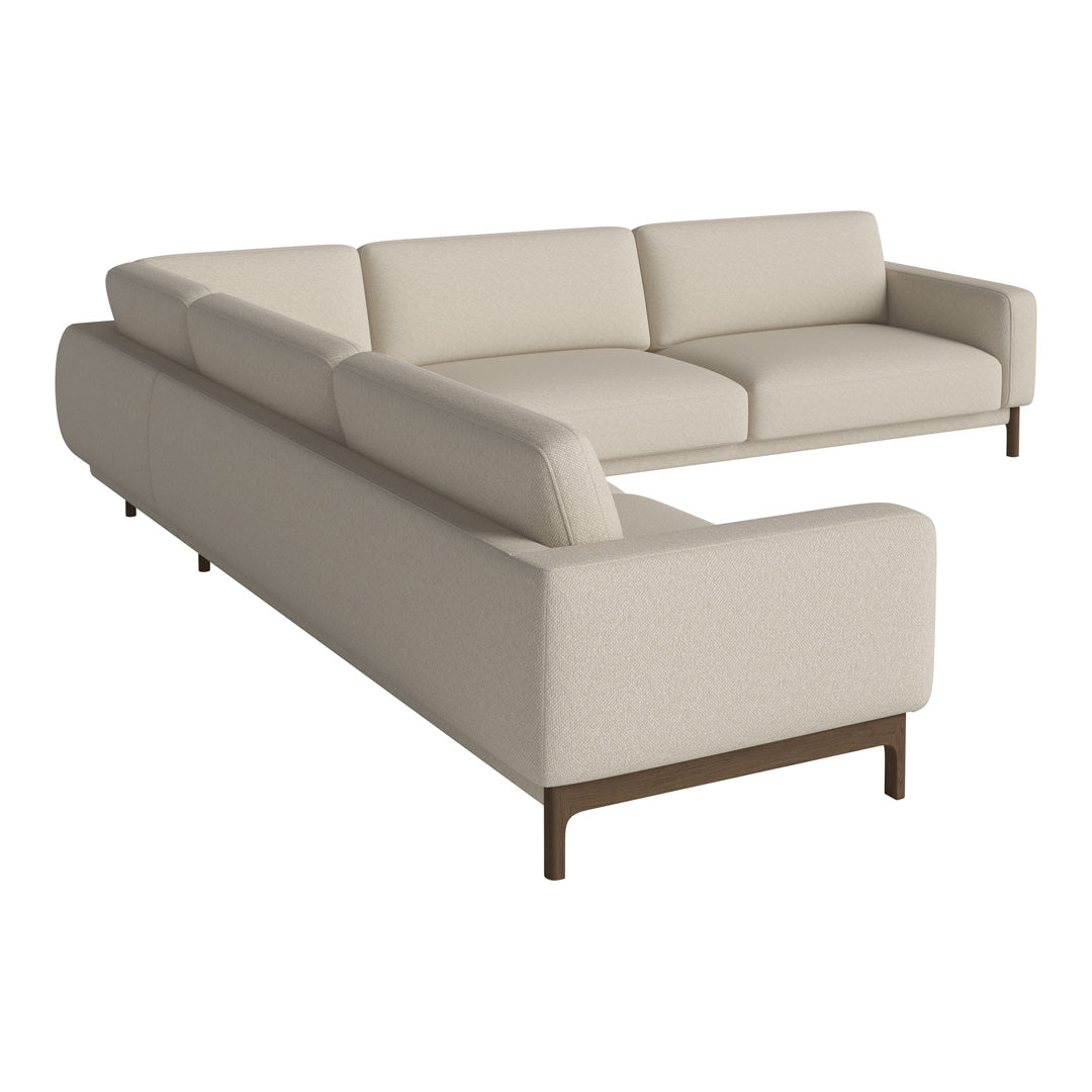 Beige sectional sofa with clean lines and textured fabric, featuring a minimalist design and dark wooden legs.