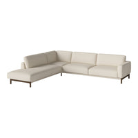 Light beige sectional sofa with smooth upholstery and sleek wooden legs for a modern, minimalist look.