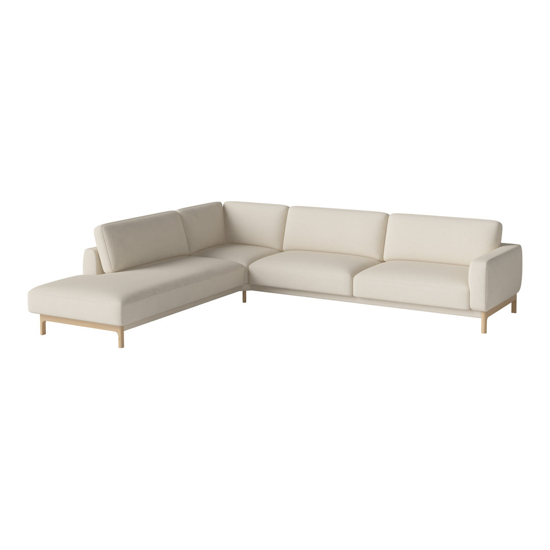 Light beige sectional sofa with a clean, minimalist design and natural wood legs, perfect for modern decor.