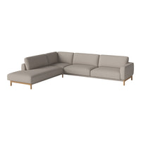 Beige sectional sofa with clean lines and a modern design, featuring soft upholstery and natural wood legs.