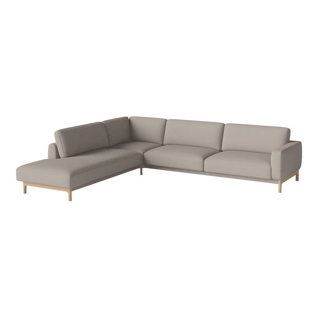 Light gray sectional sofa with smooth fabric and natural wood legs, featuring a modern, minimalist design.
