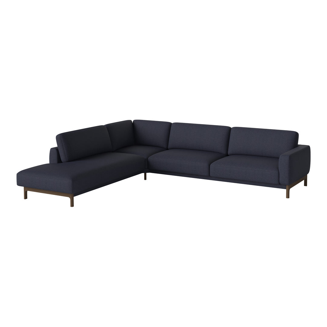 Navy blue sectional sofa with smooth fabric and minimalist design, featuring solid wood legs for a modern touch.