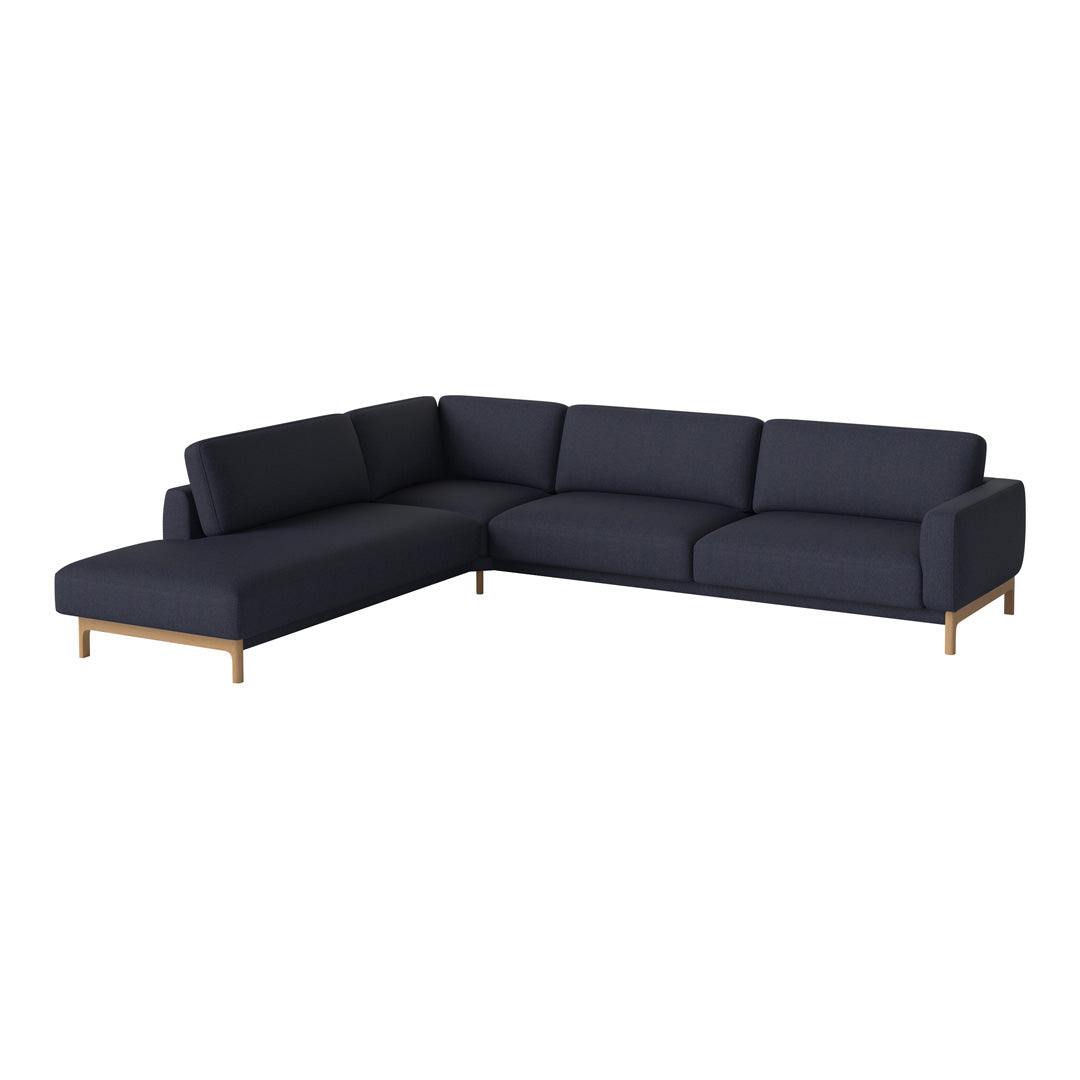 Navy blue sectional sofa with a sleek design and wooden legs, perfect for modern living spaces.