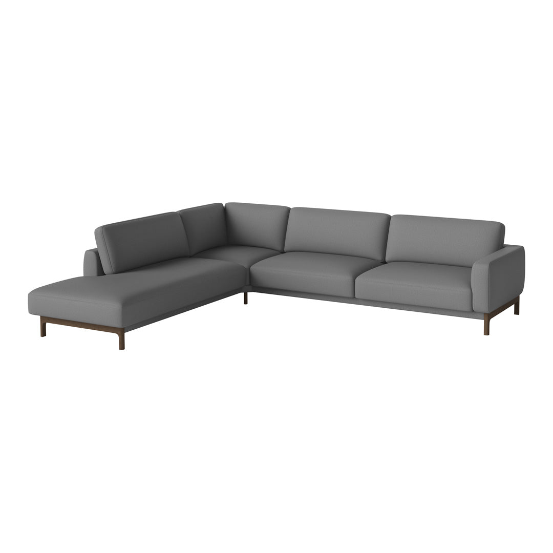 Gray sectional sofa with clean lines and minimalistic design, featuring smooth upholstery and wooden legs.