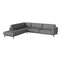 Gray sectional sofa with clean lines and minimalistic design, featuring smooth upholstery and wooden legs.