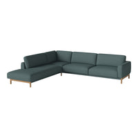 Teal sectional sofa with a modern design, featuring clean lines and wooden legs. Perfect for contemporary living spaces.