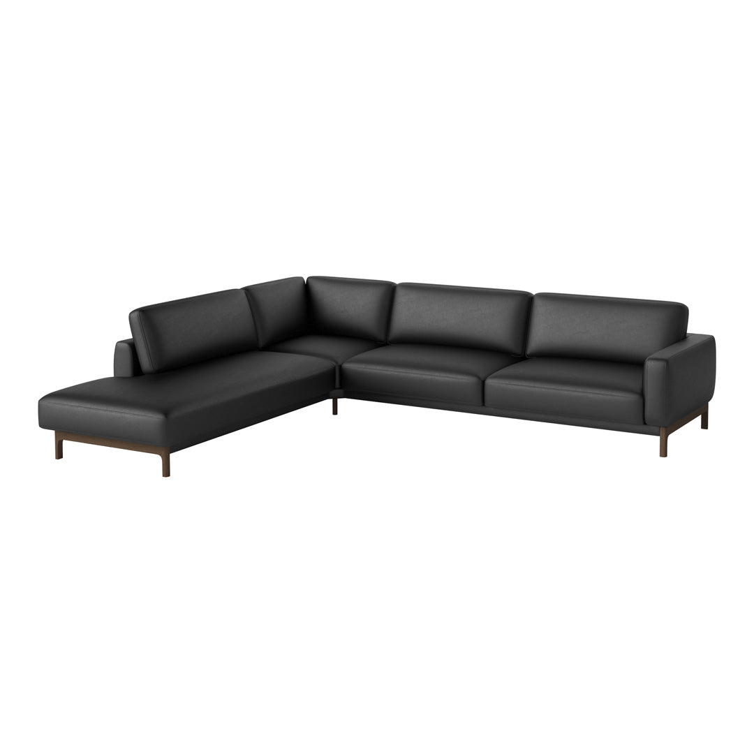 Black leather sectional sofa with clean lines and simple modern design, featuring solid wood legs.