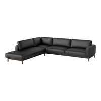 Black leather sectional sofa with clean lines and simple modern design, featuring solid wood legs.