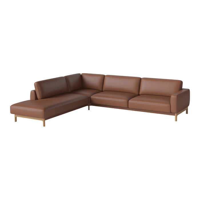 Brown leather sectional sofa with simple, modern design and smooth texture, featuring light wood legs.