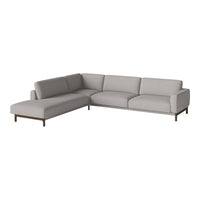 Light gray sectional sofa with smooth fabric and minimalist design, featuring simple, elegant lines.