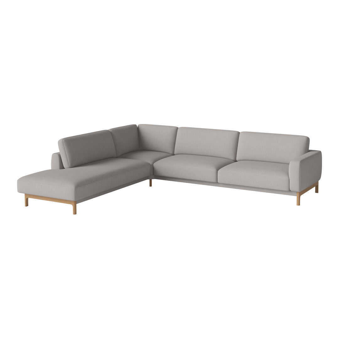 Light gray fabric sectional sofa with smooth, clean lines and minimalistic design, featuring natural wood legs.