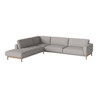 Light gray fabric sectional sofa with smooth, clean lines and minimalistic design, featuring natural wood legs.