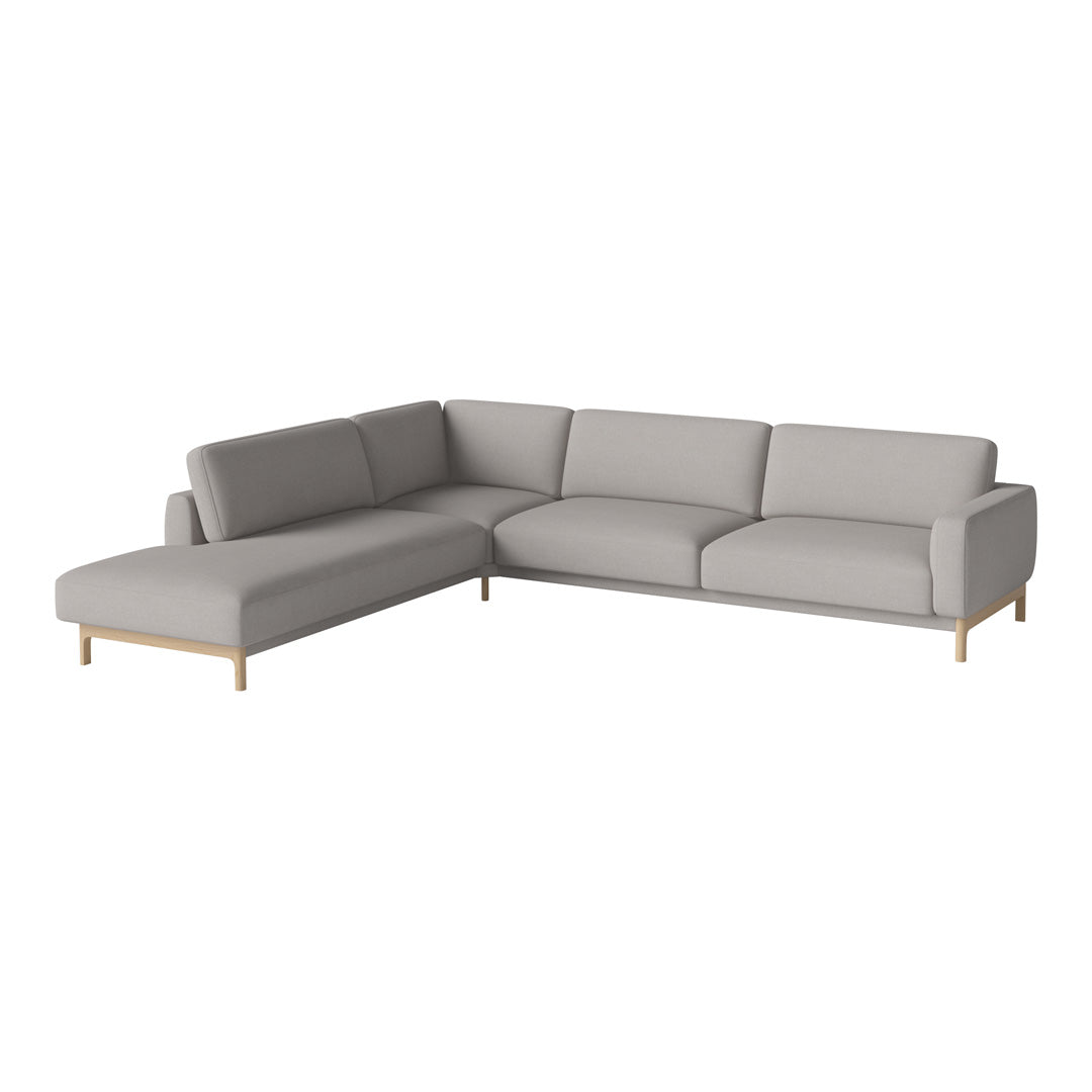 Modern gray sectional sofa with clean lines and a minimalist design, featuring a light wood frame and plush cushions.