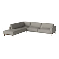 Light gray sectional sofa with smooth upholstery and wooden legs, perfect for modern living spaces.