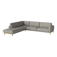 "Light gray fabric sectional sofa with smooth lines and minimalistic design, featuring wooden legs."