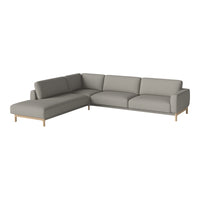 Light gray sectional sofa with a smooth, modern design and wooden legs, perfect for contemporary living rooms.