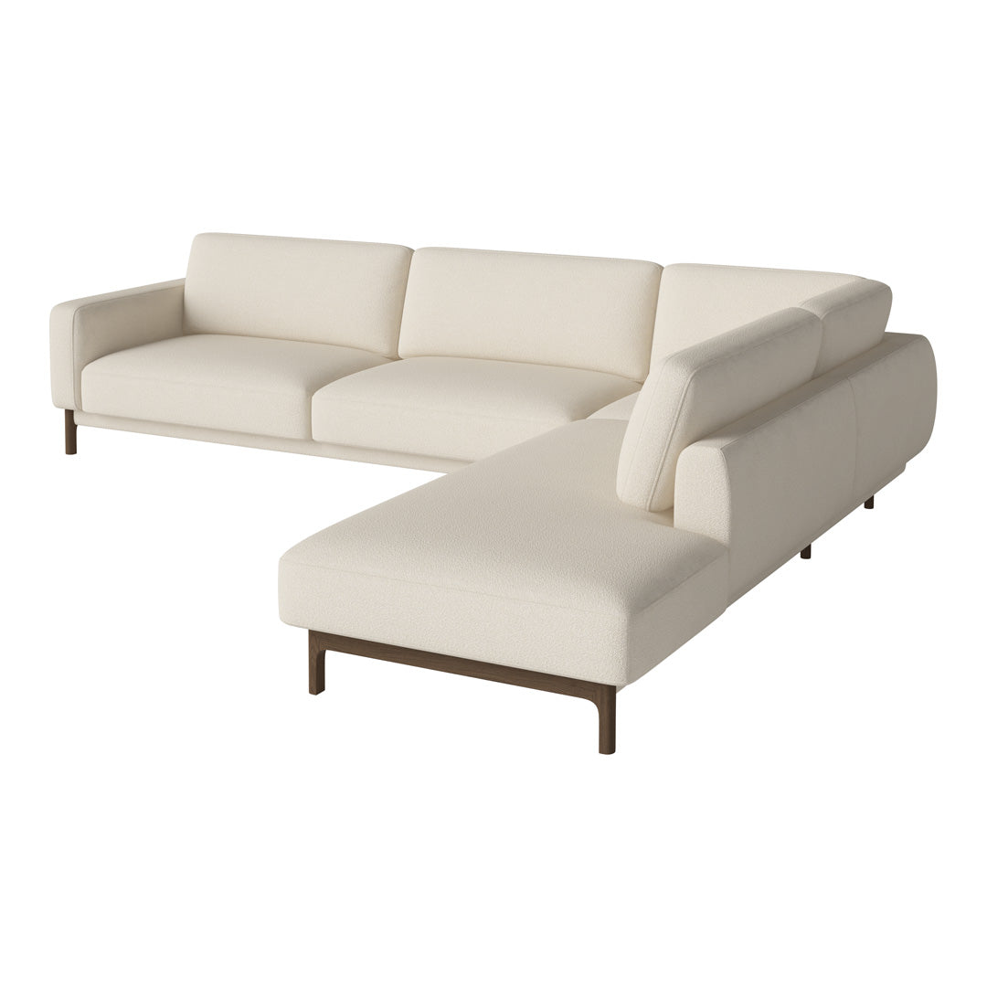 Cream-colored sectional sofa with clean lines and minimalist design, perfect for modern interiors.