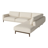 Cream-colored sectional sofa with clean lines and minimalist design, perfect for modern interiors.