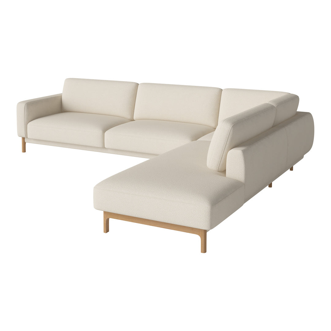 Modern beige sectional sofa with clean lines and wooden legs, perfect for minimalist decor.