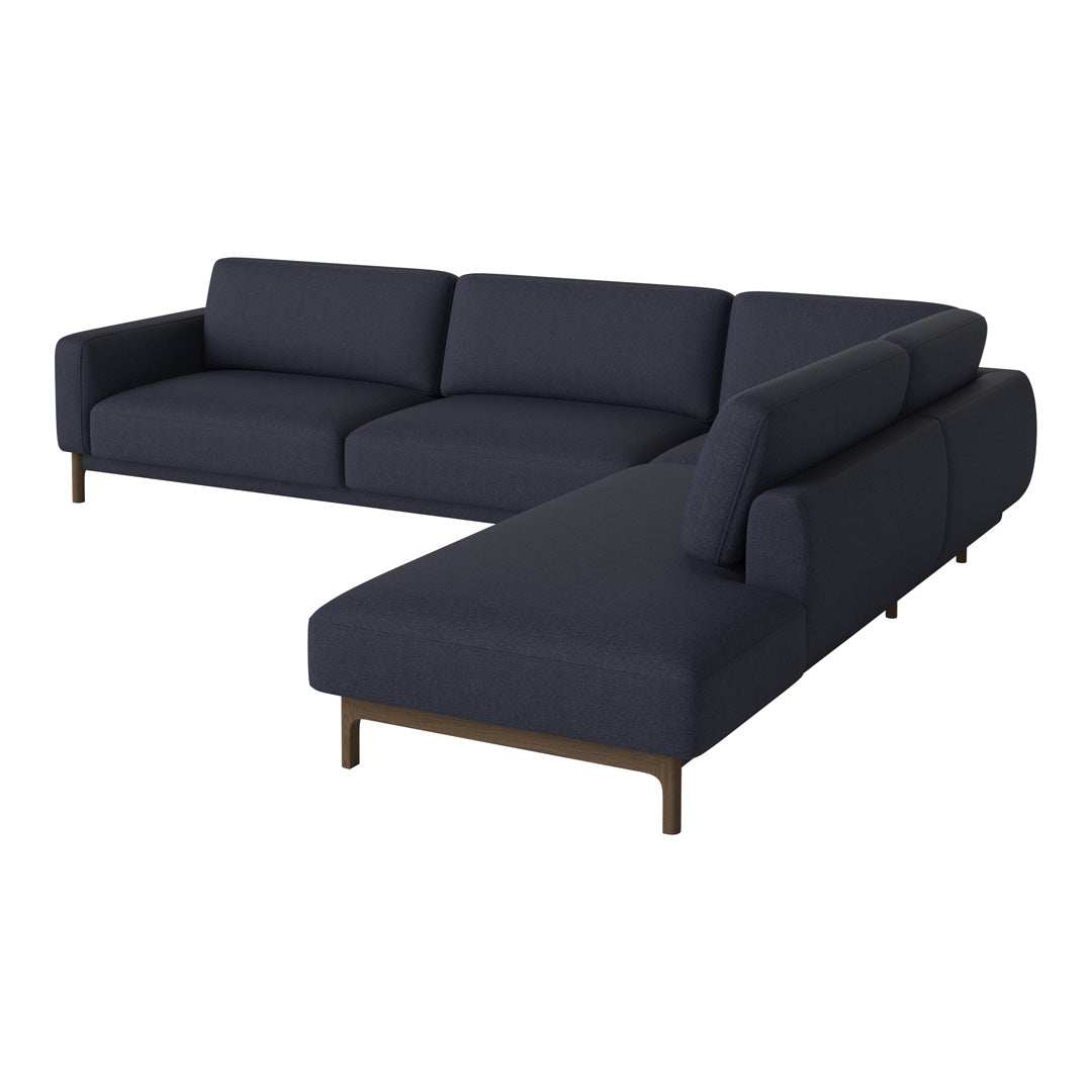 Dark navy blue sectional sofa with sleek, modern lines and smooth upholstery. Ideal for contemporary living spaces.