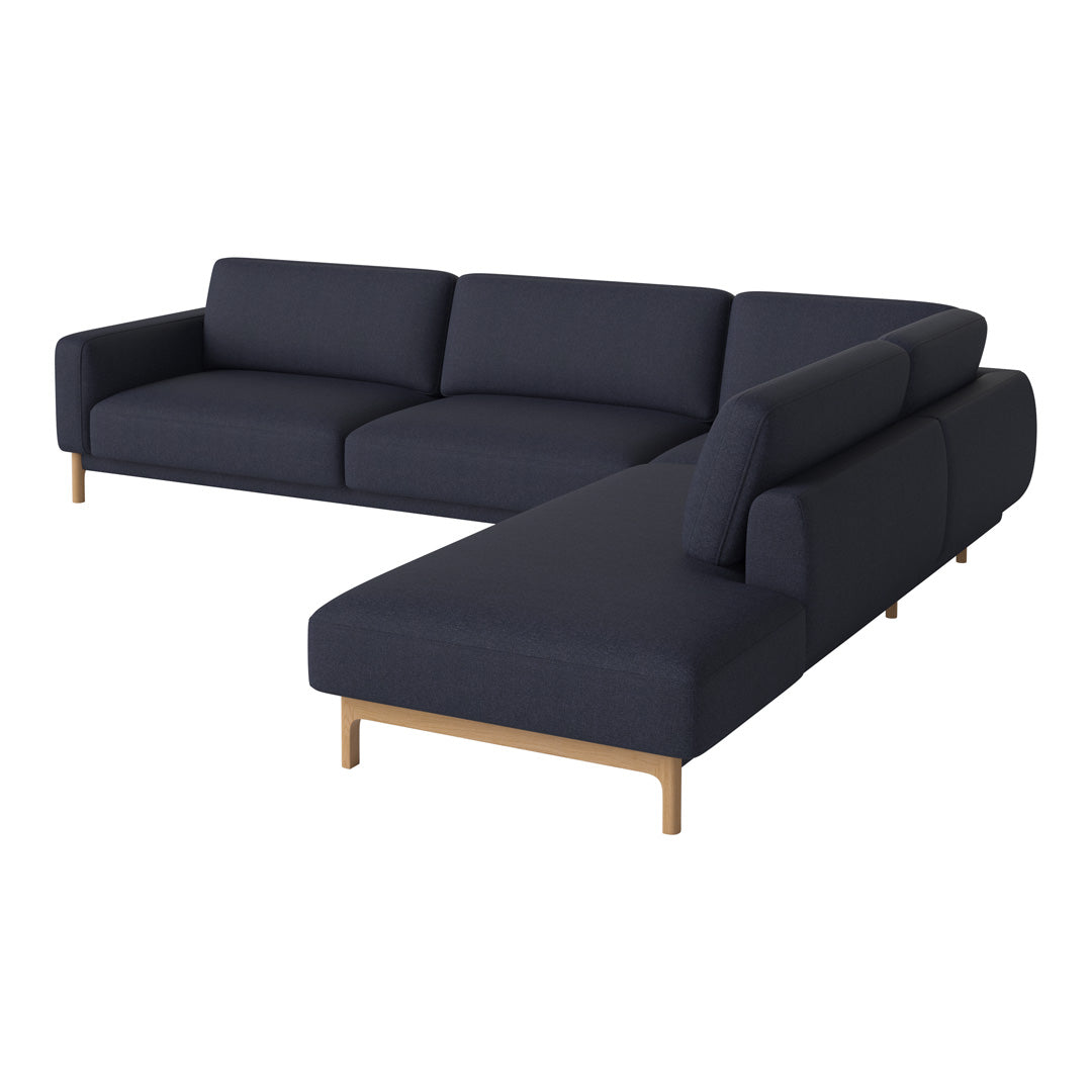 Modern navy blue sectional sofa with a sleek design and subtle texture, featuring light wood legs. Perfect for any living space.