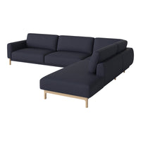 Dark navy blue sectional sofa with clean lines and minimalist design, featuring light wooden legs.