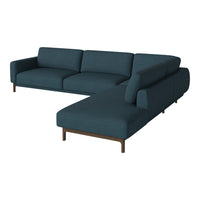 Teal sectional sofa with clean lines, featuring a solid fabric pattern and walnut legs for a modern look.