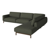 Dark green fabric sectional sofa with clean lines and a modern design, featuring smooth, textured upholstery.