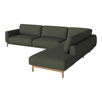 Dark green modular sofa with clean lines, featuring a smooth fabric texture and light wooden legs.