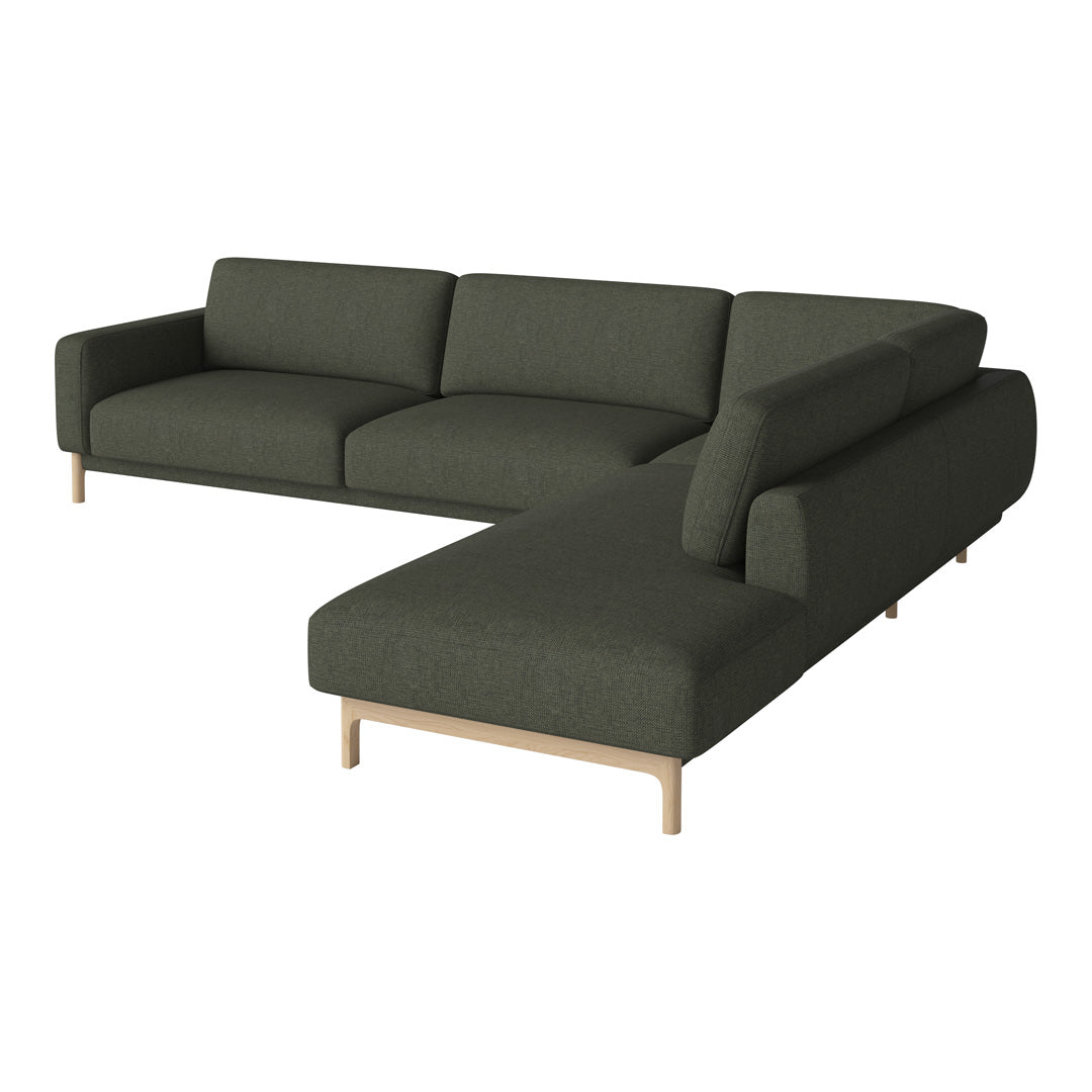 Dark green fabric sectional sofa with a minimalist design and light wood legs, ideal for modern interiors.
