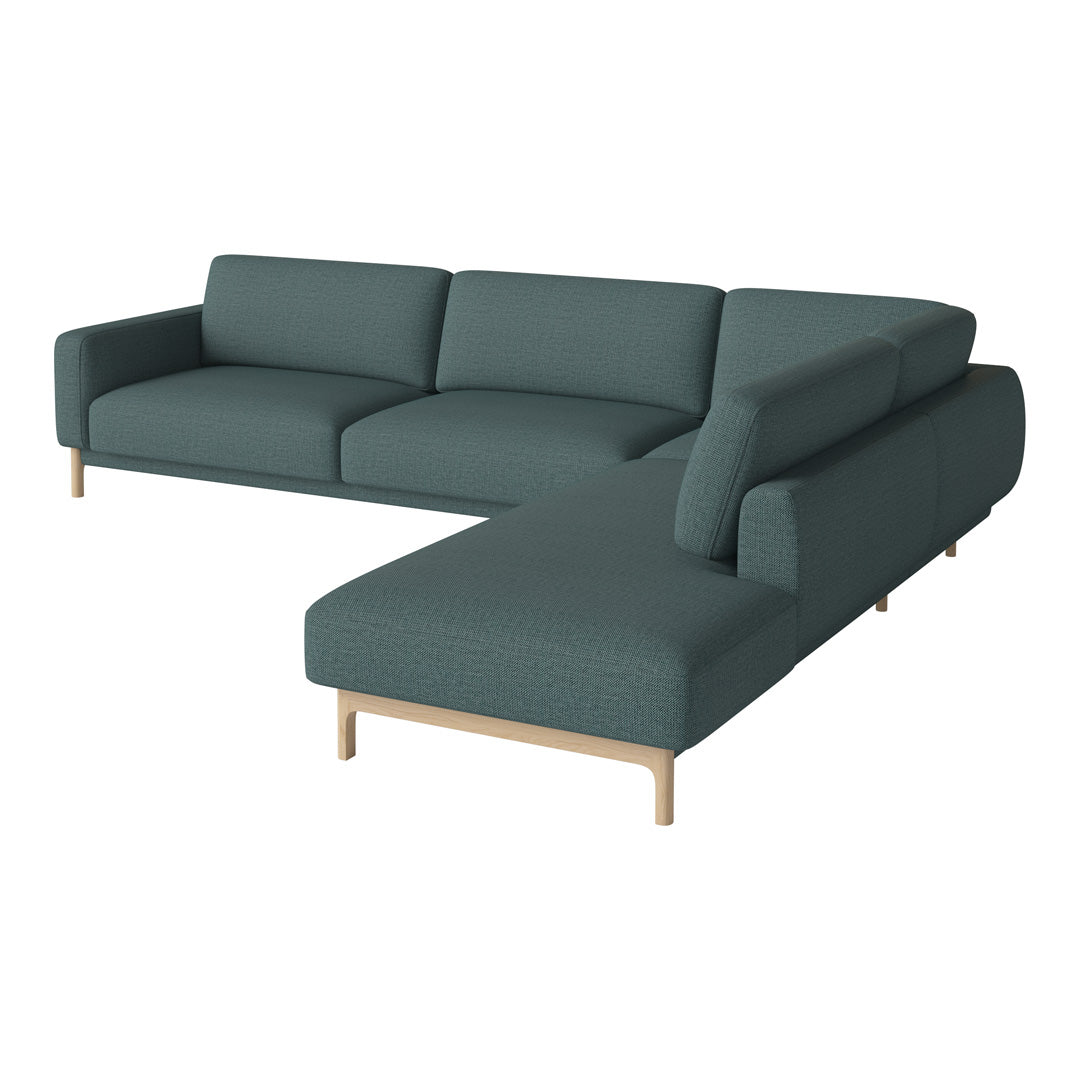 Teal fabric sectional sofa with a modern design and light wood legs, featuring clean lines and a minimalist aesthetic.