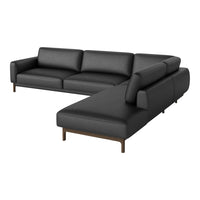 Black leather sectional sofa with sleek design and wooden legs, perfect for modern living spaces.