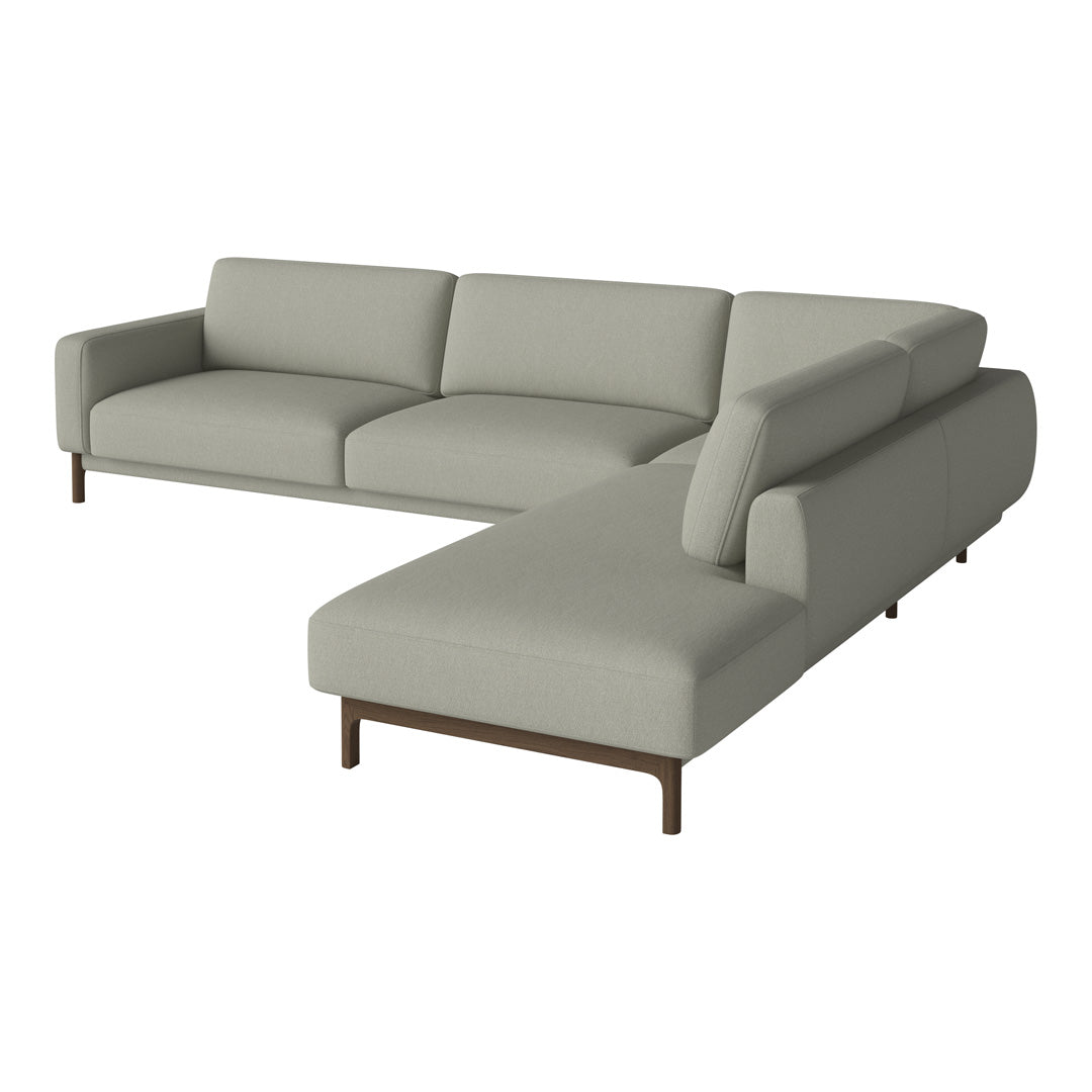 Light gray sectional sofa with a minimalist design and smooth fabric, featuring a modern wood base.