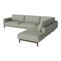 Light gray sectional sofa with a minimalist design and smooth fabric, featuring a modern wood base.