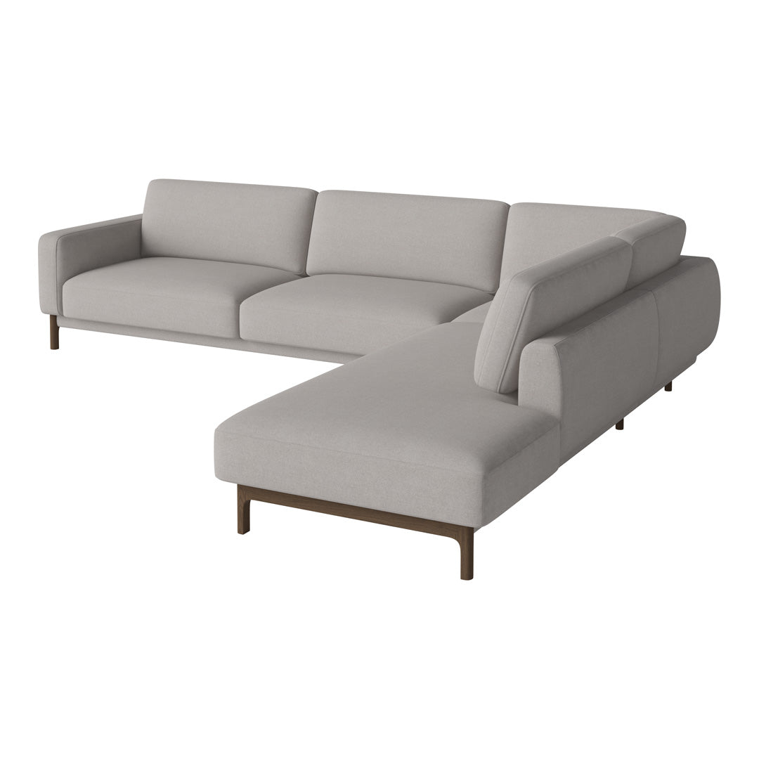 Light gray sectional sofa with clean lines and a modern, minimalistic design. Smooth fabric with subtle texture.