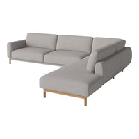 Light grey sectional sofa with smooth fabric and minimalistic design, featuring natural wood legs. Perfect for modern spaces.