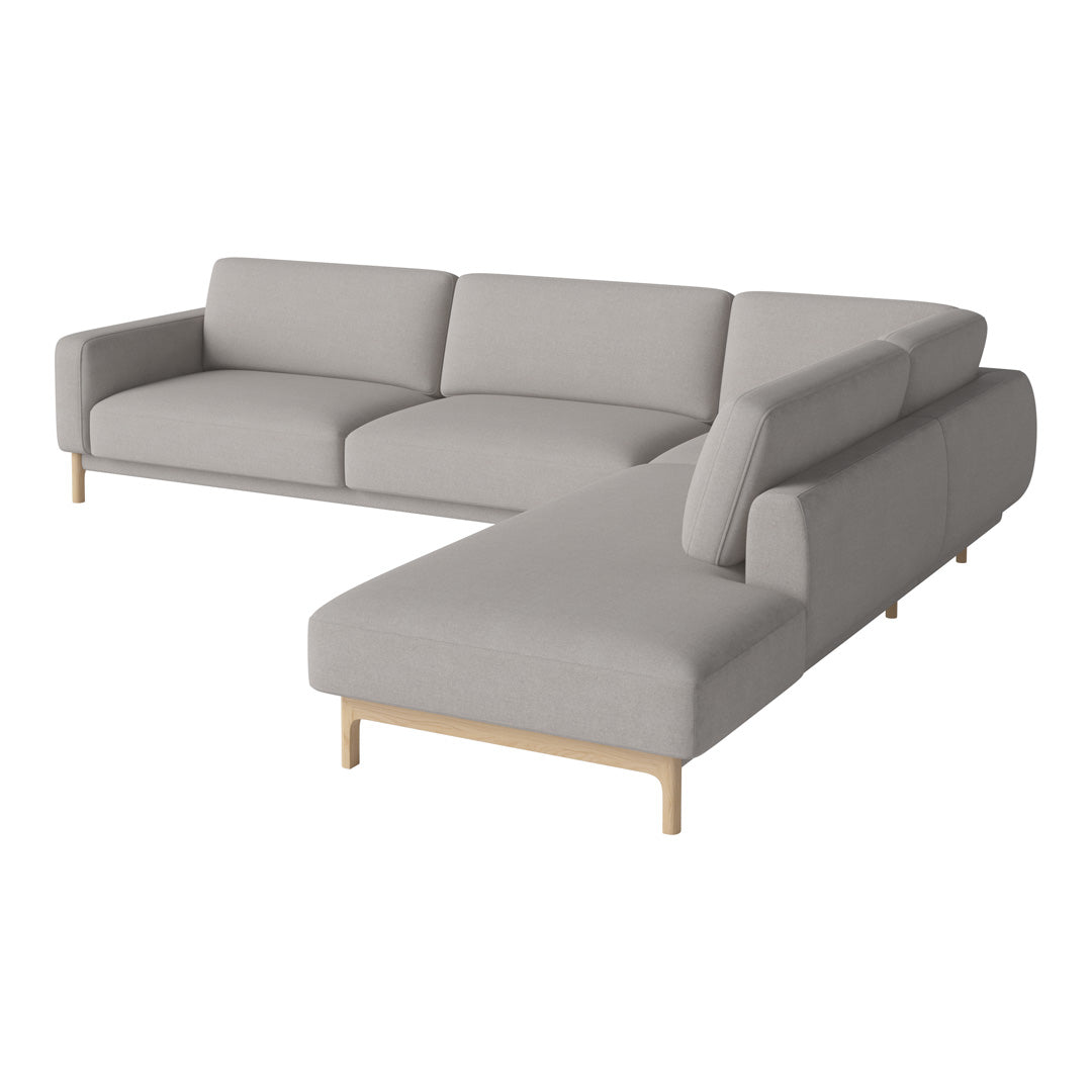 Light gray sectional sofa with a smooth fabric finish and minimalist design, featuring natural wood legs.