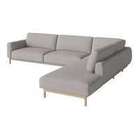 Light gray sectional sofa with a smooth fabric finish and minimalist design, featuring natural wood legs.