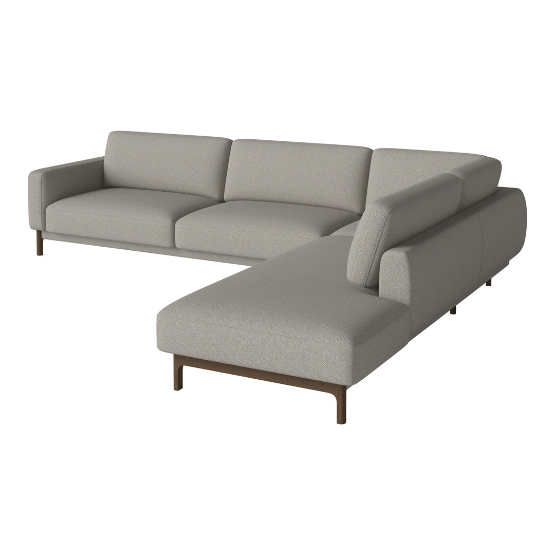 Light gray sectional sofa with sleek lines and soft fabric, featuring a minimalist design and subtle textures.