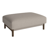 Cream upholstered ottoman with a textured surface and dark wood legs, offering a modern and minimalist design.