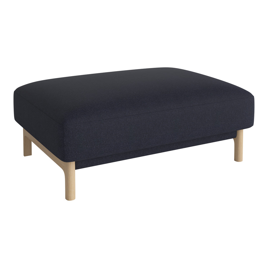 Navy blue upholstered ottoman with light wooden legs, featuring a smooth, modern design.