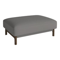Gray upholstered ottoman with a smooth texture and wooden legs, featuring a minimalist design.