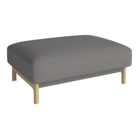Gray upholstered ottoman with a minimalist design and light wooden legs. Ideal for modern decor.