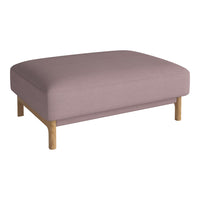Soft lavender ottoman with smooth fabric and natural wood legs, perfect for modern decor.
